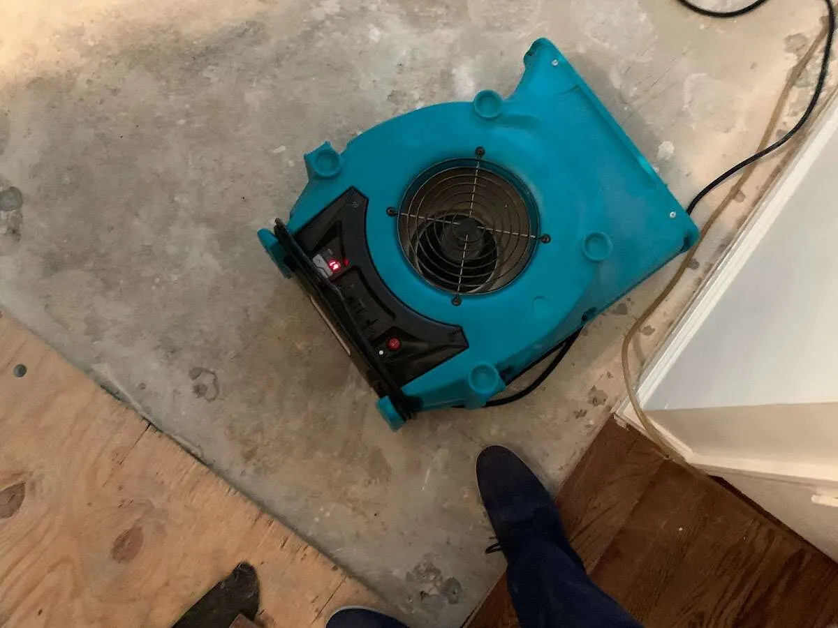 Air mover drying subfloor during Leak Detection & Repair in Gurnee